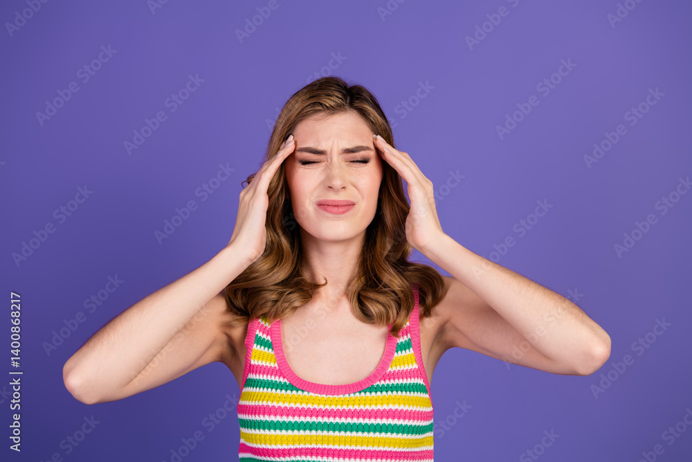 Young woman with a headache gesture over vibrant purple background exuding casual fashion and stylish confidence in summer attire Young woman with a headache gesture over vibrant purple background exuding casual fashion and stylish confidence in summer attire