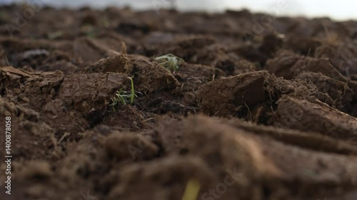 Ploughed soil with shovel in ground