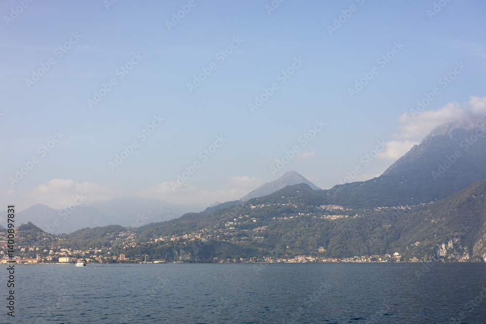 Como Lake landscape. Village, trees, water and mountains. Italy, Europe. Como Lake landscape. Village, trees, water and mountains. Italy, Europe.