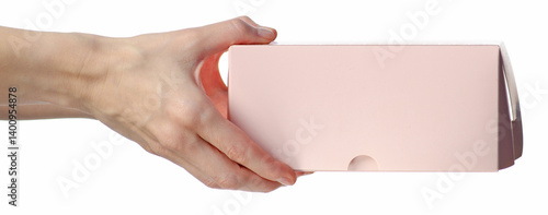 Pink bakery box for cakes or cookies in hand on white background isolation