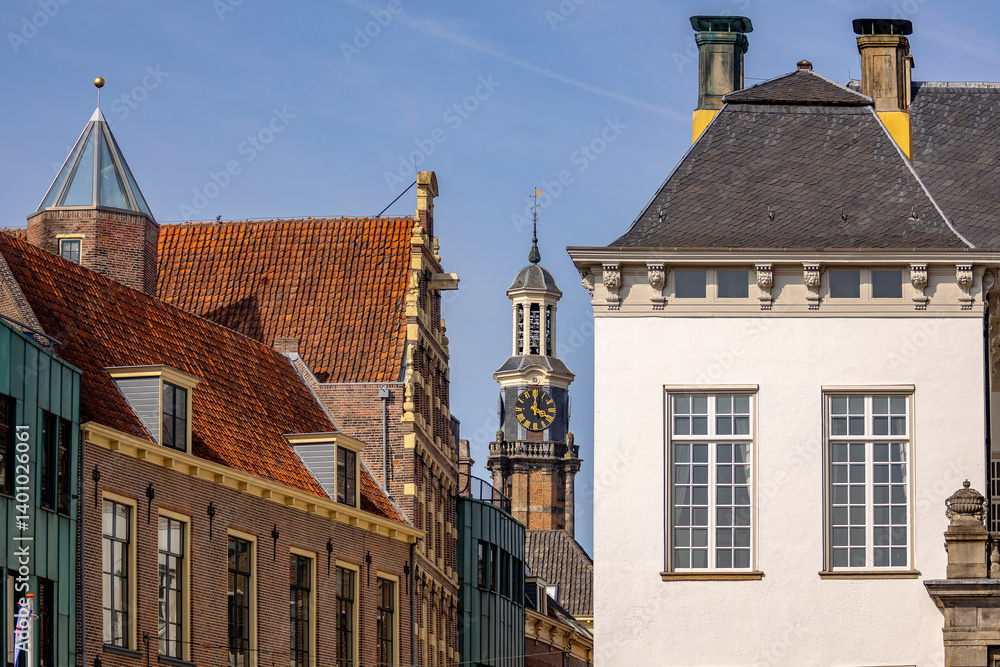 Fototapeta premium City hall and civic hall with Wijnhuistoren historic tower town Zutphen, The Netherlands, buildings colourful medieval exterior facades on a sunny day