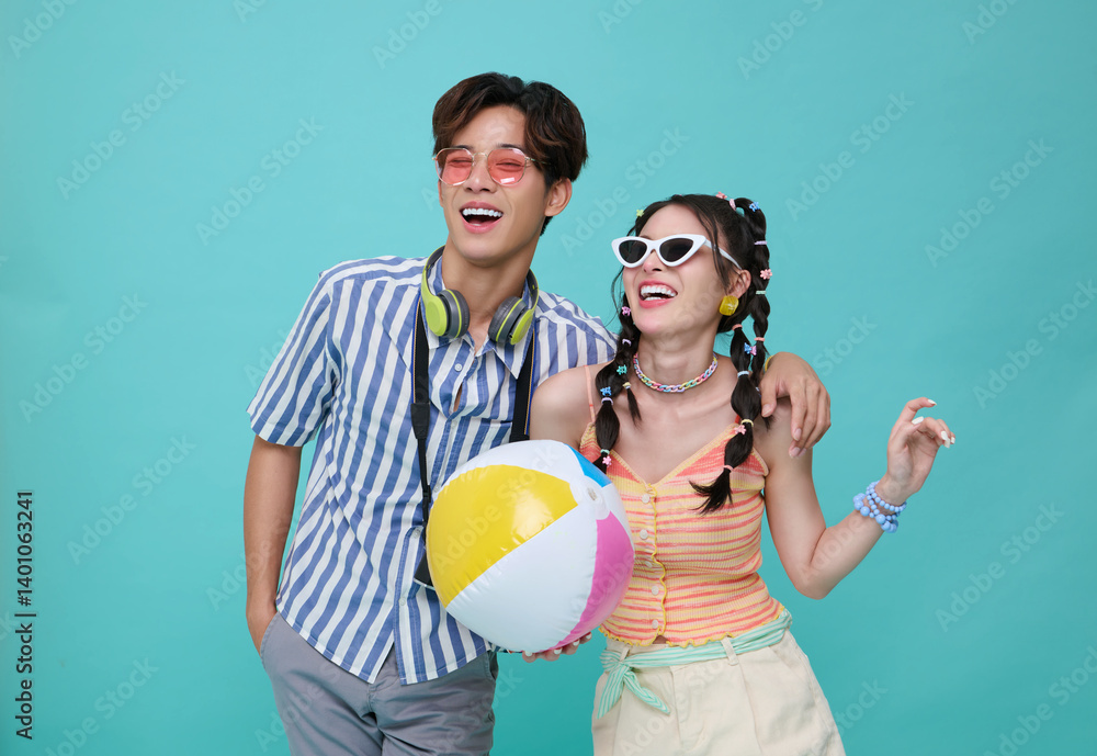 Happy Asian couple traveler dressed in summer clothes isolated on blue background, Tourist having cheerful holiday trip concept Happy Asian couple traveler dressed in summer clothes isolated on blue background, Tourist having cheerful holiday trip concept
