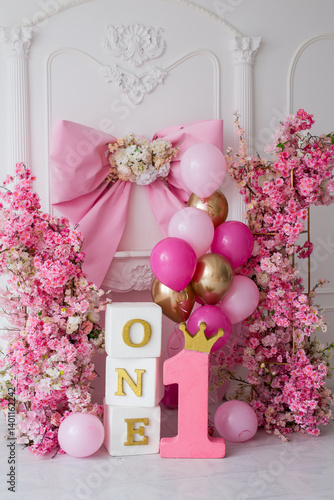 Pink decor with flowers for first birthday