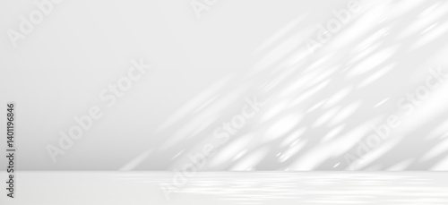 Glare from the sun's rays on the wall. Blurred shadows from leaves and plants in the room. Soft overlay of natural light. Abstract background for product presentation.Natural light layout.