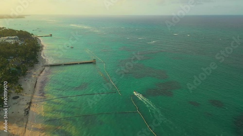 Wallpaper Mural Aerial view of tropical waters with a speedboat sailing at sunset Torontodigital.ca