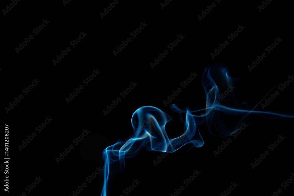 Fototapeta premium Wispy blue smoke wave flowing against a black background, creating a sense of mystery and elegance. Abstract and atmospheric concept. Swirling, writhing smoke to overlay on your photos