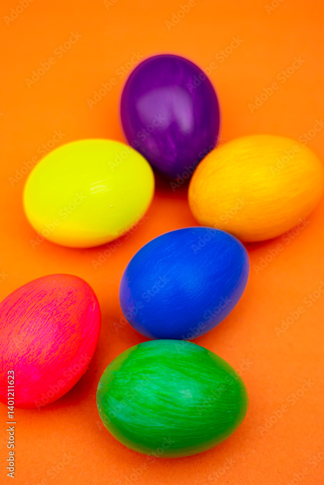 Easter Flat Lay with Multicolor Eggs in Rustic Bowl Isolated On Orange Easter Flat Lay with Multicolor Eggs in Rustic Bowl Isolated On Orange