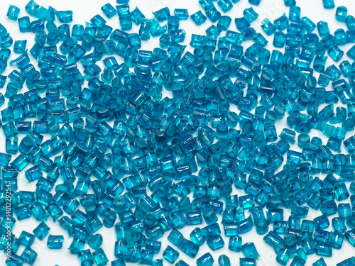 Clear blue masterbatch granules on white background, color pigment carrier polymer in plastic industry. Perfect for plastic company catalog design