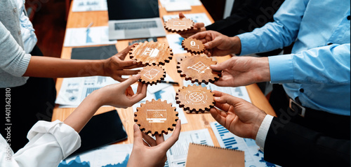 A dynamic business meeting scene showcasing diverse hands holding gears with business graphics, surrounded by charts, documents, and technology to inspire collaboration. Amity