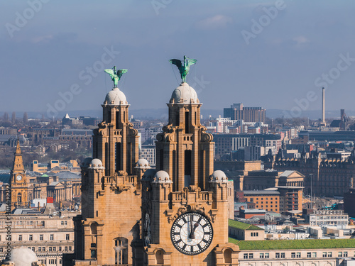 Obraz na płótnie Aerial view of Liverpool showcasing the Royal Liver Building with its clock towers and Liver Birds, surrounded by historic and modern city structures. w salonie