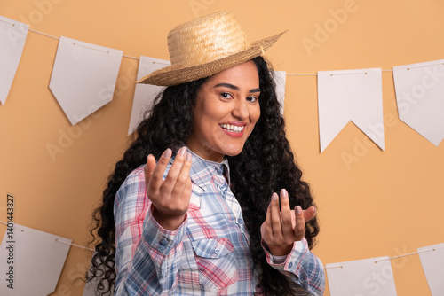 joyful brazilian woman to Festa Junina in Brazil in beige background. calling and inviting 