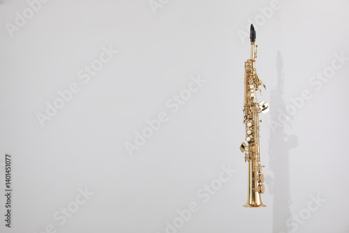 Tablou pe pânză Golden soprano saxophone on light grey background. Space for text