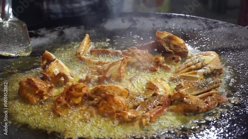 Hilsha fish is fried in a big pan along with shrimp and eggplant, Hilsha Fish and shrimp Simmering in mustard oil, traditional Bengali style fried hilsa and eggplant	