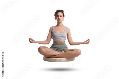 Wallpaper Mural Young woman levitating during meditation on white background. Practicing yoga Torontodigital.ca