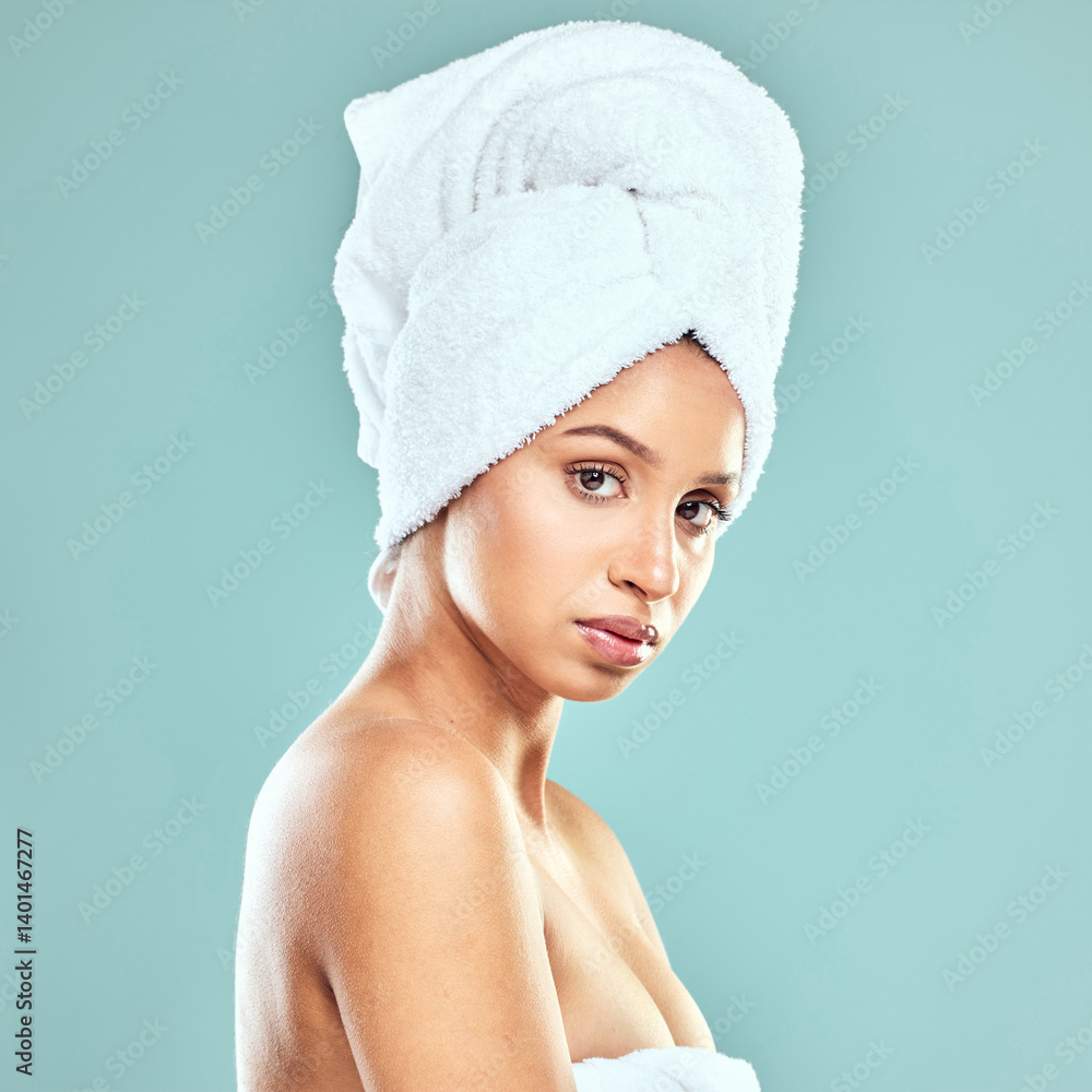 Portrait, woman and towel for skincare in blue background, beauty and routine for healthy skin. Face, female model and self care, natural glow for cosmetics or dermatology with haircare in studio Portrait, woman and towel for skincare in blue background, beauty and routine for healthy skin. Face, female model and self care, natural glow for cosmetics or dermatology with haircare in studio