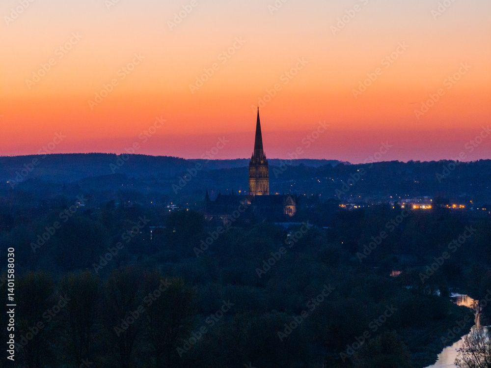 Fototapeta premium Aerial shot of Salisbury Cathedral at sunset