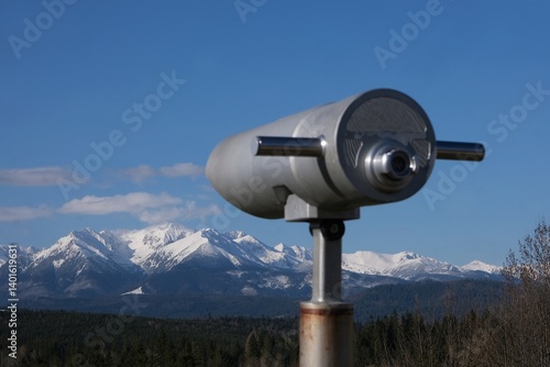Obraz na płótnie Viewpoint Pass over Lapszanka with snow-capped peaks of High Tatras and Bialskie Tatras mountains and blurred binoculars in foreground, Poland w salonie