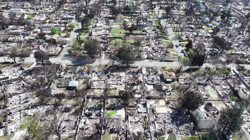 Aerial drone shot of the LA fires with burnt and destroyed homes in Altadena neighborhood in Los Angeles, California.