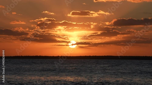  Warm Sunset with Soft Sun Rays Through Clouds