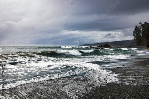 View of beach and clouds in sombrio beach, vancouver island, british colombia, canada 