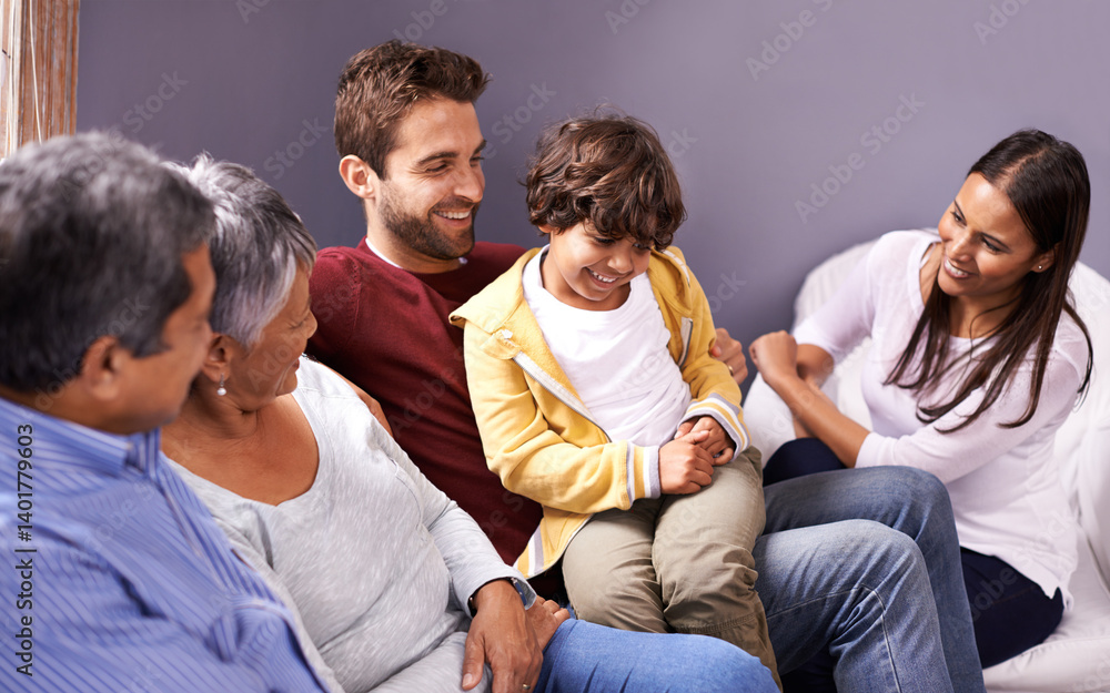 Happy grandparents, parents and child in home for bonding, relationship and relax together. Big family, senior generation and mother, father and young boy on sofa for holiday, vacation and weekend Happy grandparents, parents and child in home for bonding, relationship and relax together. Big family, senior generation and mother, father and young boy on sofa for holiday, vacation and weekend