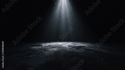 A dimly lit scene featuring a dark surface illuminated by a beam of light, creating a serene and mysterious atmosphere.