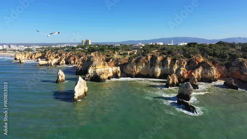 The beautiful rocky coast of the Algarve towards Albufeira, Europe, Portugal, Algarve, in summer on a sunny day. 