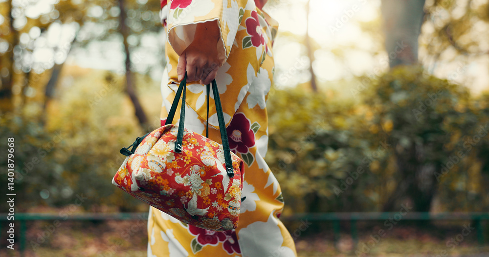 Asian woman, hands and walking with kimono or bag in nature for travel, tradition or culture. Japan, closeup and strolling with stylish fashion, luggage or handbag for tourism or commute at park Asian woman, hands and walking with kimono or bag in nature for travel, tradition or culture. Japan, closeup and strolling with stylish fashion, luggage or handbag for tourism or commute at park