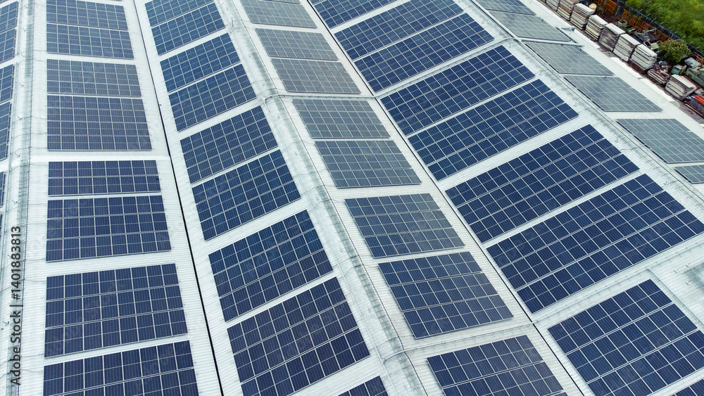 multiple solar panels installed on the rooftop of a building. The solar panels are arranged in neat rows and columns, with clear separations between each panel.