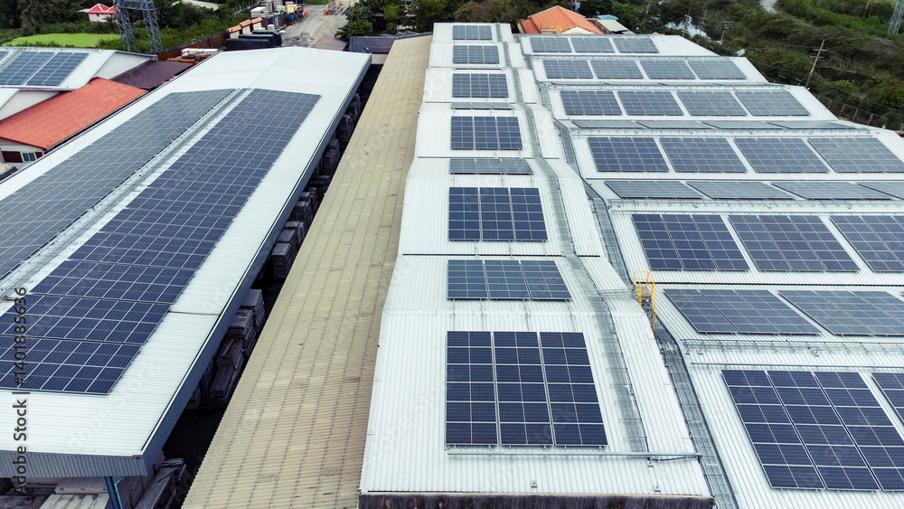 multiple solar panels installed on the rooftop of a building. The solar panels are arranged in neat rows and columns, with clear separations between each panel.