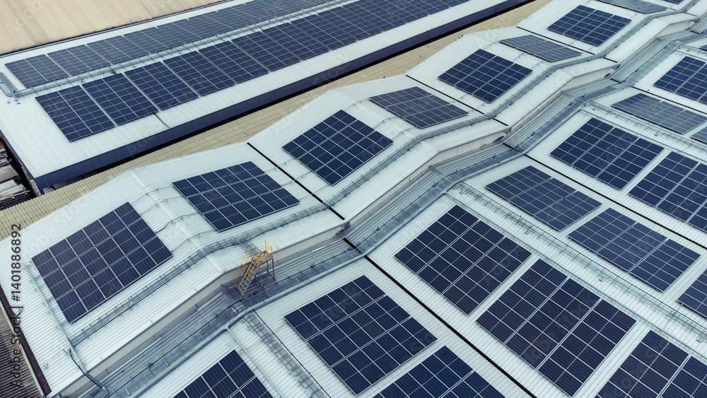 multiple solar panels installed on the rooftop of a building. The solar panels are arranged in neat rows and columns, with clear separations between each panel. multiple solar panels installed on the rooftop of a building. The solar panels are arranged in neat rows and columns, with clear separations between each panel.