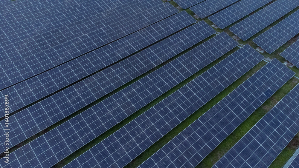 multiple solar panels installed on the rooftop of a building. The solar panels are arranged in neat rows and columns, with clear separations between each panel. multiple solar panels installed on the rooftop of a building. The solar panels are arranged in neat rows and columns, with clear separations between each panel.