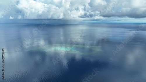 Calm, serene seas surround a remote atoll in the Togian Islands of Central Sulawesi, Indonesia. This beautiful equatorial region is known for its extraordinary marine biodiversity.