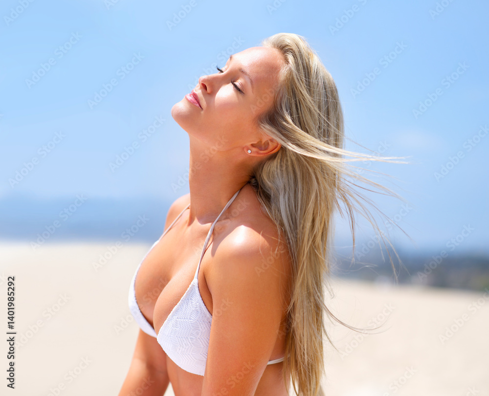 Fototapeta premium Woman, bikini and beach tanning for summer vacation or travel adventure with relaxing holiday, outdoor or behind. Female person, blue sky and sunshine in Miami with swimwear for peace, resort or trip