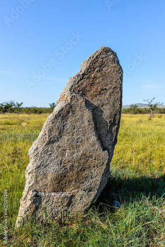 Khakassia. Old stone wall. Mountain landscape with blue sky