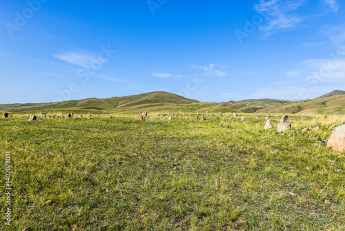 Khakassia. Old stone wall. Mountain landscape with blue sky