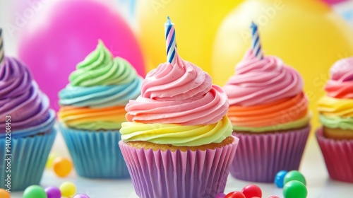 Wallpaper Mural Rainbow birthday cupcakes on festive party table with colorful balloons and bright decorations for a fun celebration theme Torontodigital.ca