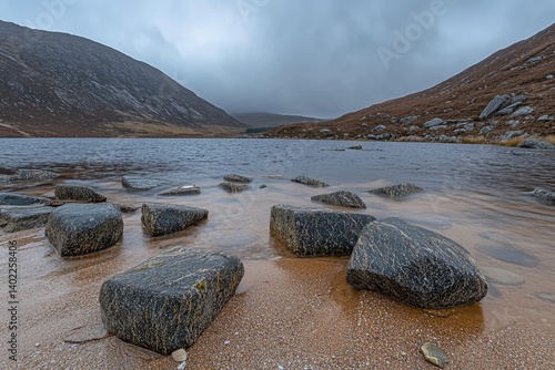 Serene Lakeside Vista Rocks Lead the Way to Moody Mountain Reflections