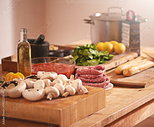 Obraz na płótnie Cooking, Italian food and vegetables in kitchen on table for meal prep for dinner, supper and lunch in home. Recipe, diet and utensils on counter with ingredients for pasta, nutrition and cuisine w salonie