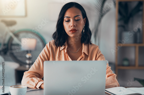 Elegant, professional and freelance worker on her laptop inside home office. Formal, stylish and fashionable corporate employee online. Remote, communication and sending emails in digital workplace.