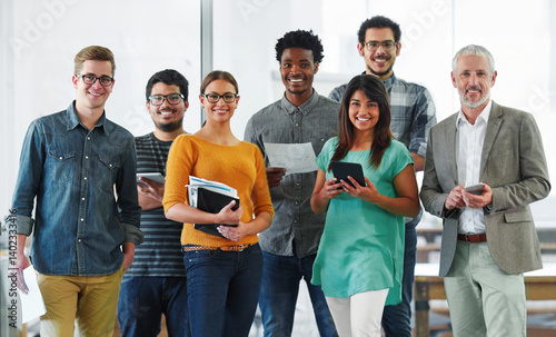 Portrait, people and happy in office with documents for teamwork, collaboration and plan as graphic designer. Employee, confident and smile for creativity, planning and brainstorming for project