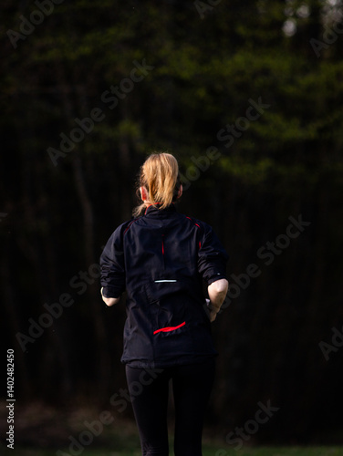 Obraz na płótnie healthy fit woman in her forties running outdoors w salonie