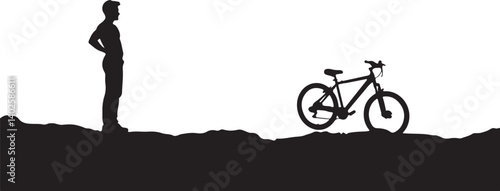 silhouette of a man with a bicycle