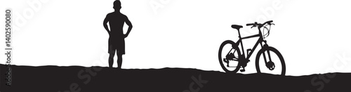 silhouette of a man with a bicycle
