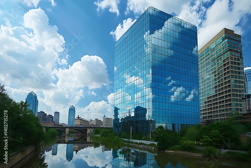 A sleek contemporary skyscraper reflecting the clouds