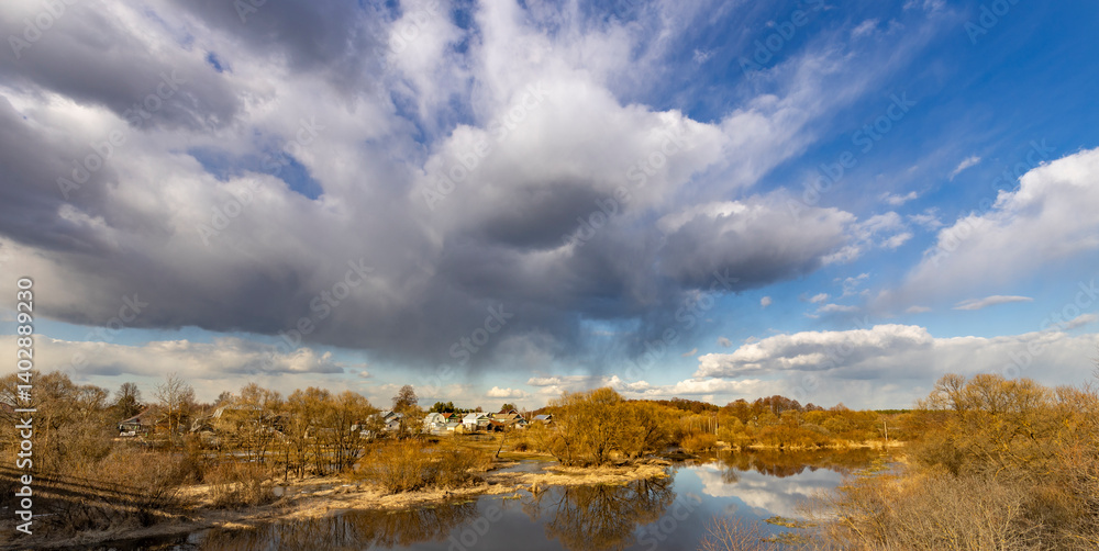 Obraz premium A cloudy sky with a few clouds in the distance