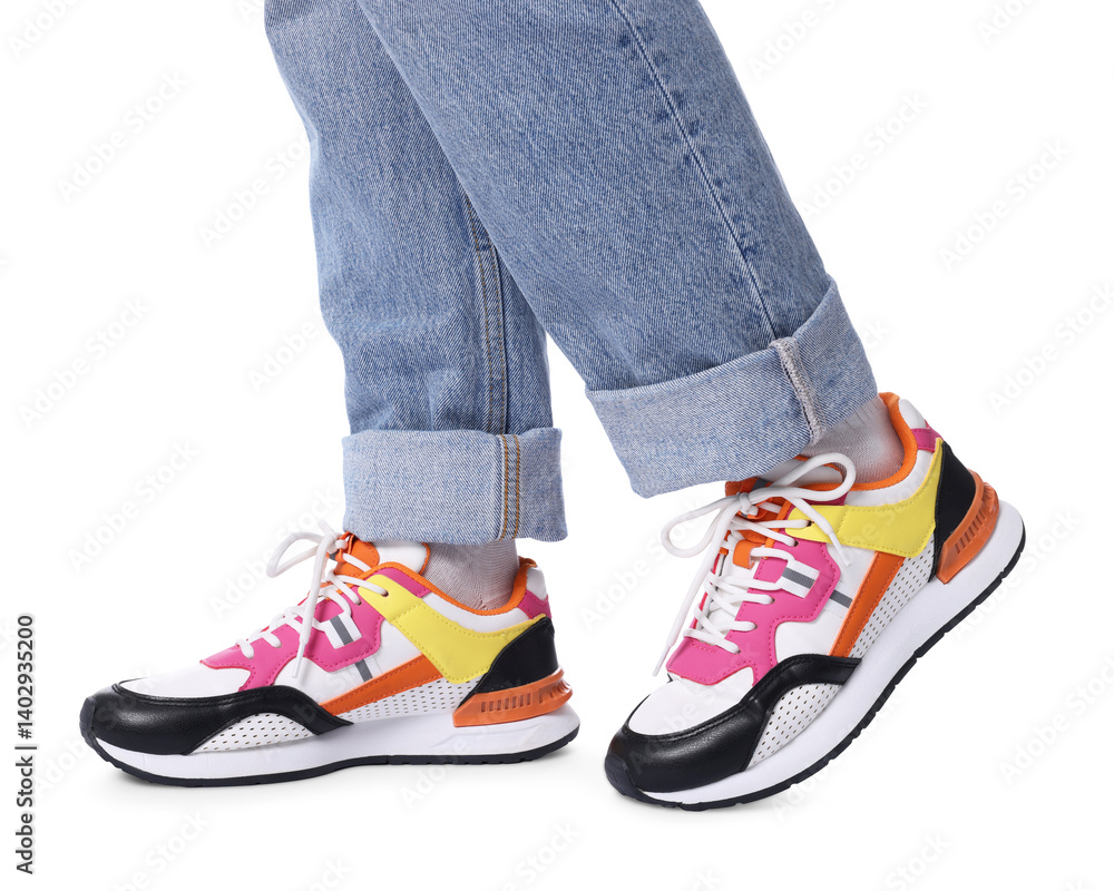 Woman wearing stylish sneakers on white background, closeup Woman wearing stylish sneakers on white background, closeup