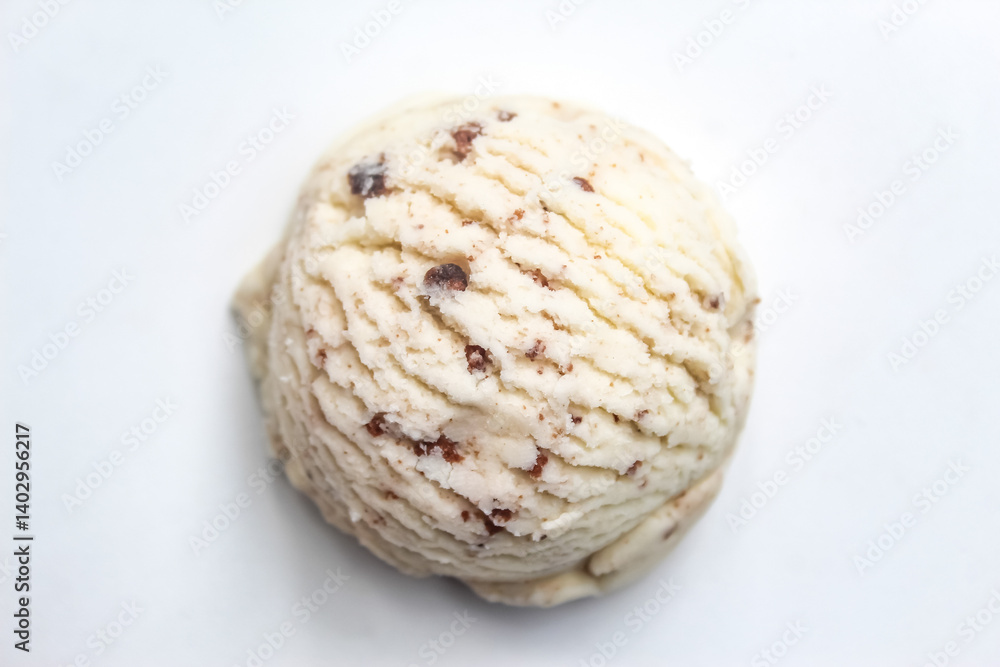 Fototapeta premium a scoop of vanilla ice cream with cookie sprinkles, isolated on a white background