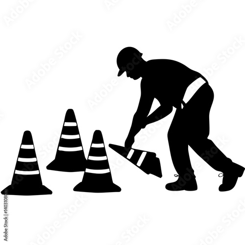 Construction Worker Placing Traffic Cones for Road Safety and Worksite Management