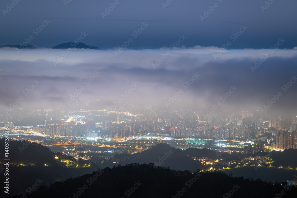 A poetic spring night at Lion's Head Mountain in Taiwan. The city breathes softly as clouds dance in harmony over the glittering skyline, weaving dreams of tranquility and wonder. A poetic spring night at Lion's Head Mountain in Taiwan. The city breathes softly as clouds dance in harmony over the glittering skyline, weaving dreams of tranquility and wonder.